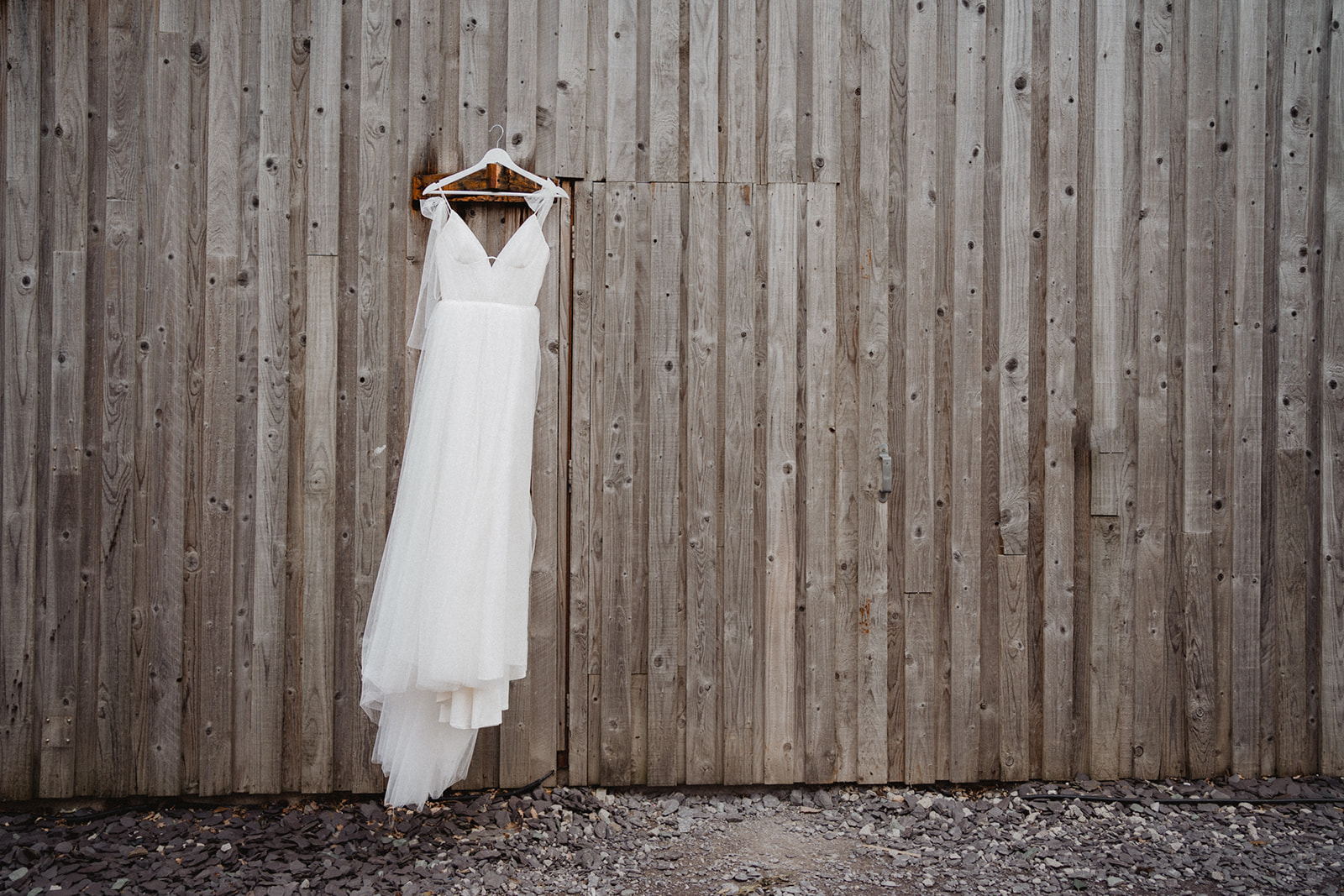 Bride's Dress hanging at the barn