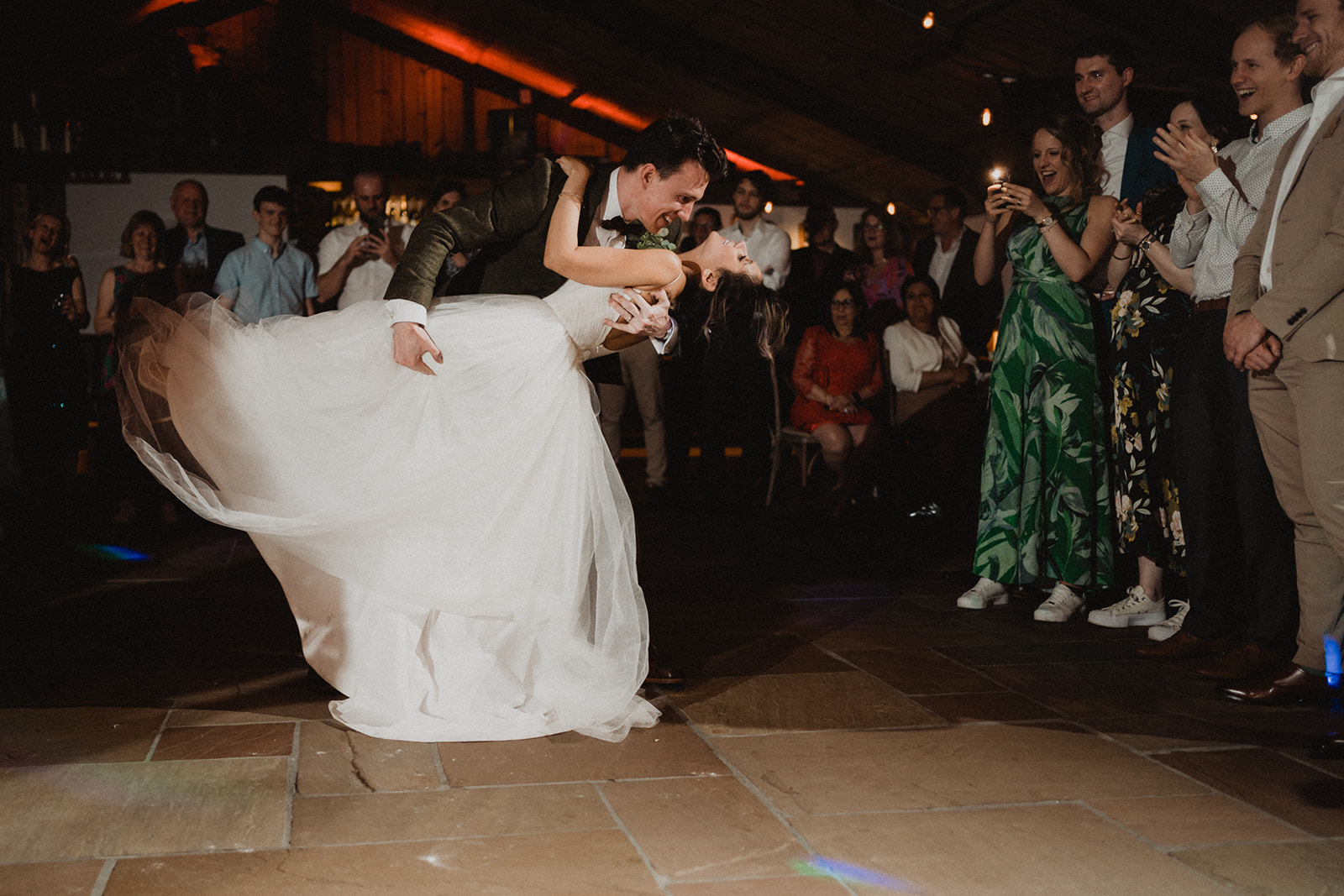 groom dipping his bride on the dance floor at their wedding