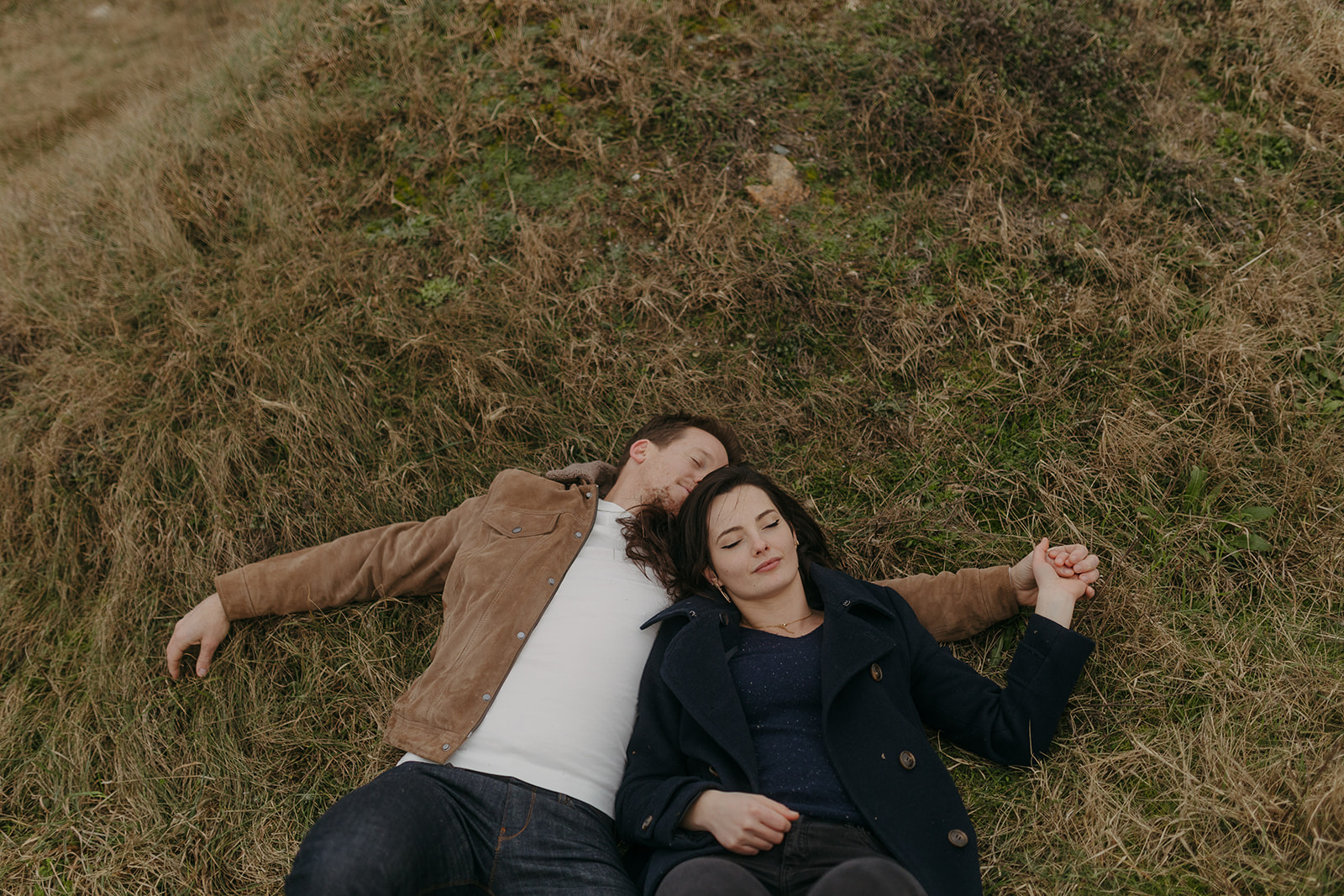 couple in love laying on the grass