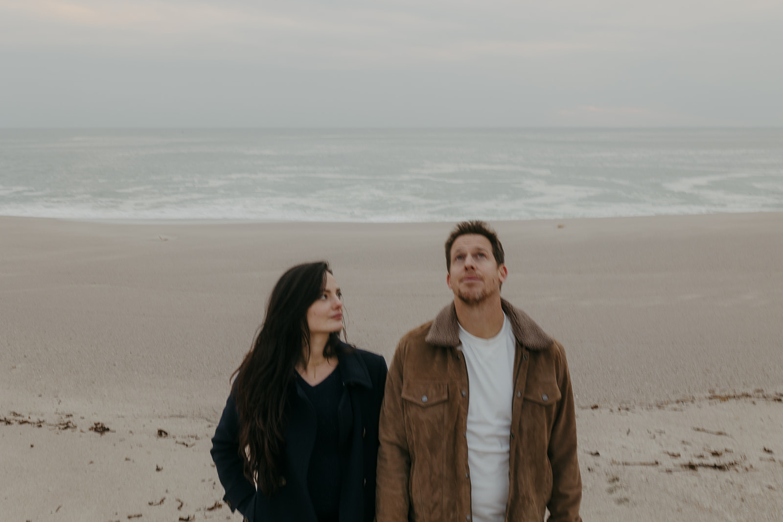 couple standing on a beach