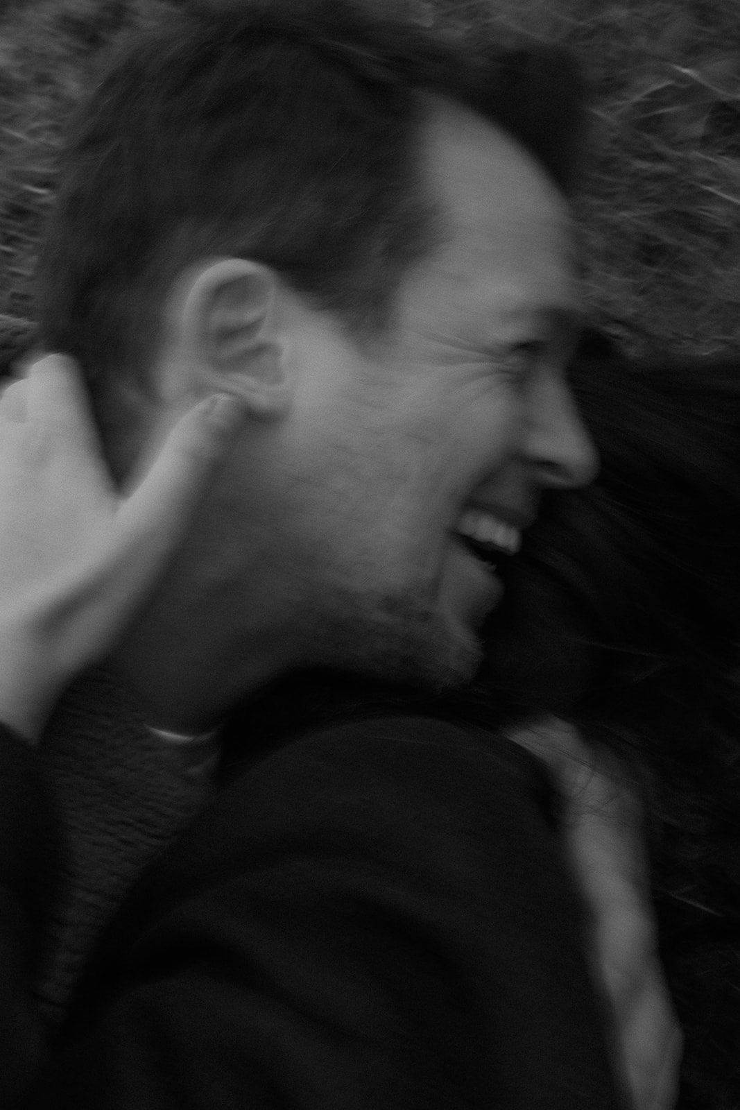 man laughing with his girlfriend