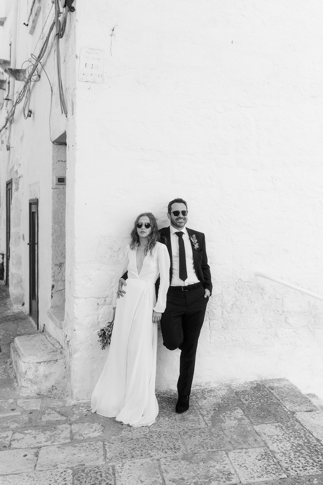 editorial black and white wedding photography of a bride and a groom in Ostuni, Italy