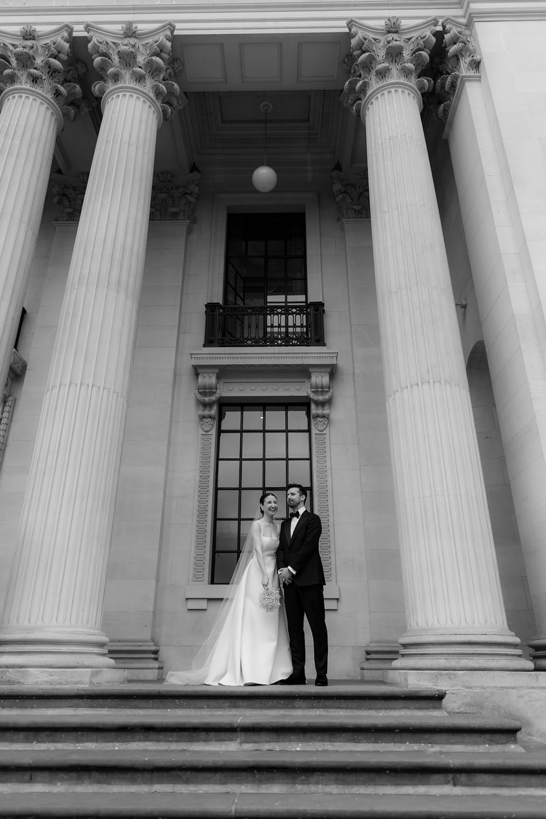 Couple getting married at Old Marylebone Town Hall in London.