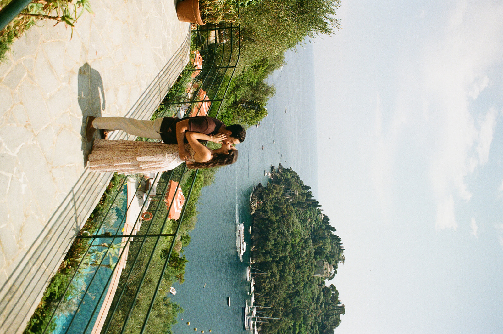 couple embrace at the iconic balcony at the hotel Belmond Splendido in Portofino