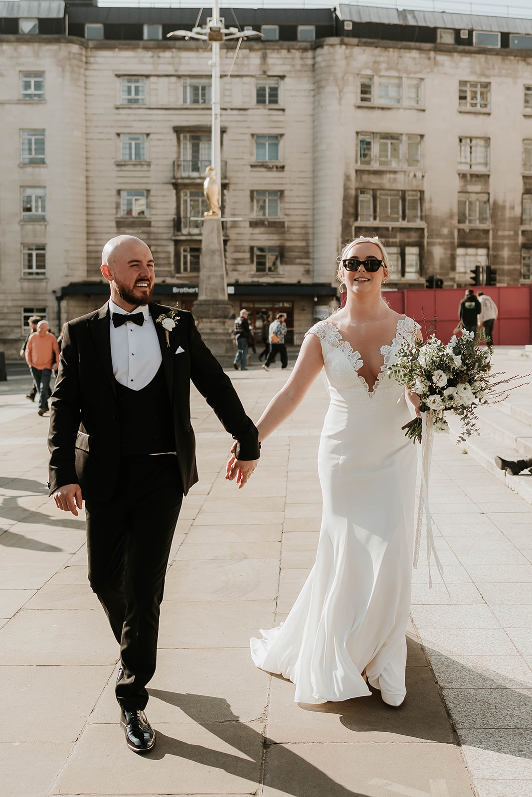 Wedding couple with a city wedding, editorial look with black tie