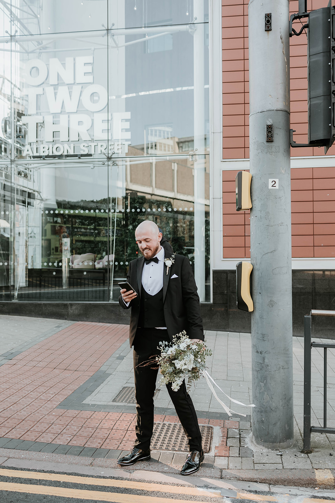 Wedding couple with a city wedding, editorial look with black tie