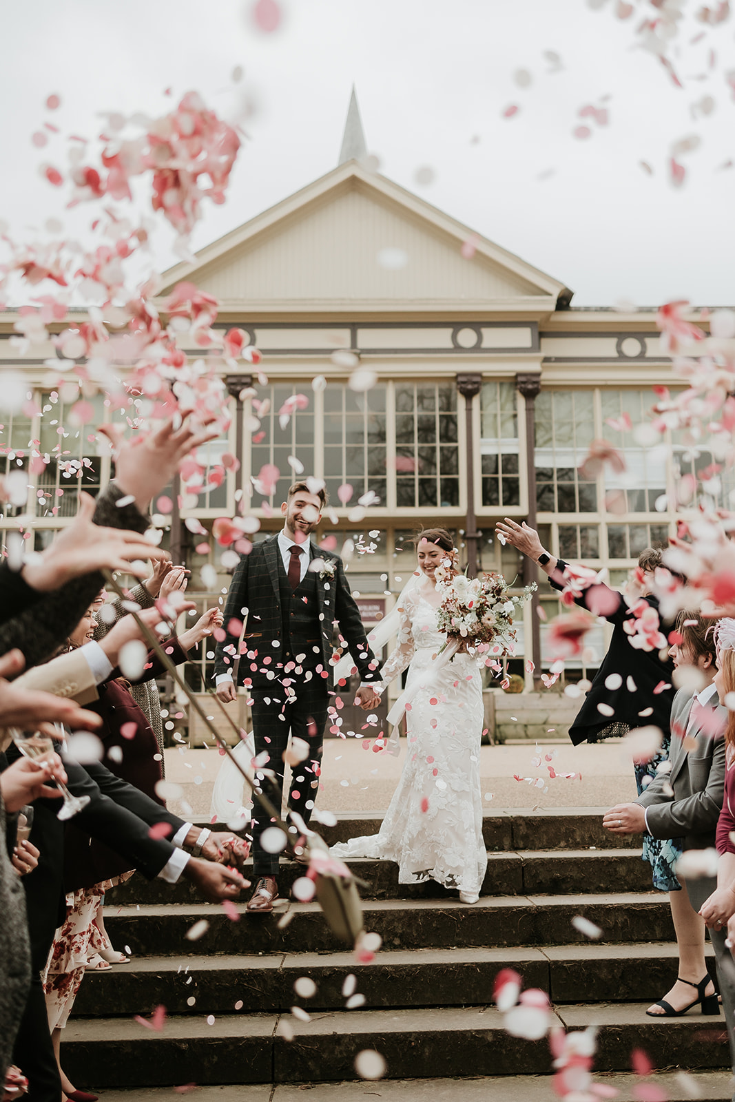 Confetti photos outside the Buxton pavilion with pink and white paper confetti. 
