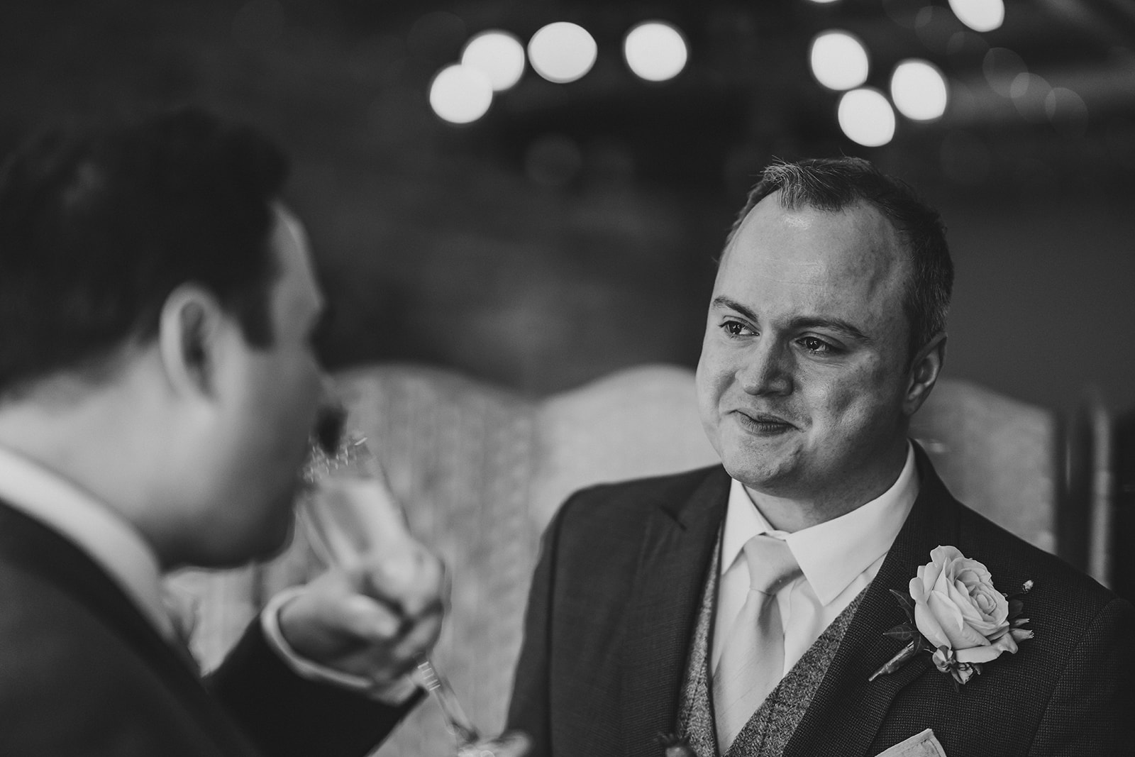 groom laughing on wedding day
